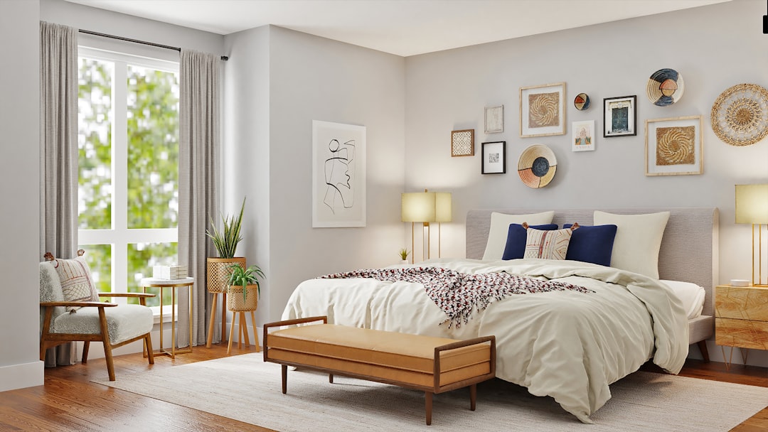 A serene and inviting bedroom setup featuring a comfortable bed, soft bedding, and warm lighting, creating a relaxing atmosphere.