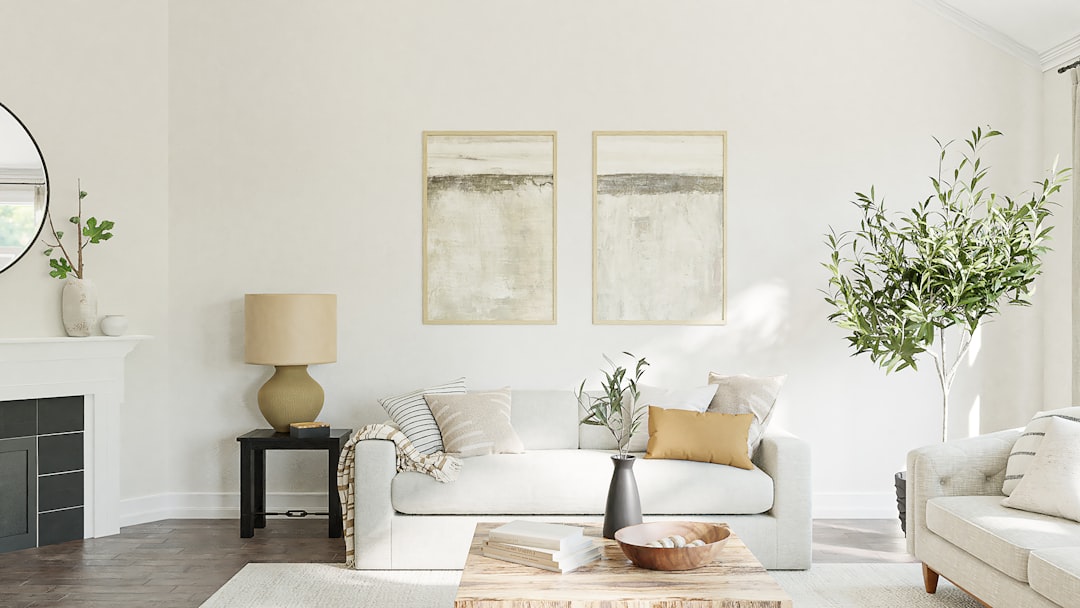 A cozy and inviting living room with affordable decor changes, featuring plants, cushions, and a fresh color palette.