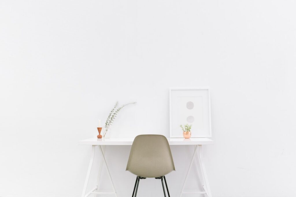 A serene and organized living space with minimal furniture and decor, showcasing a clutter-free environment.