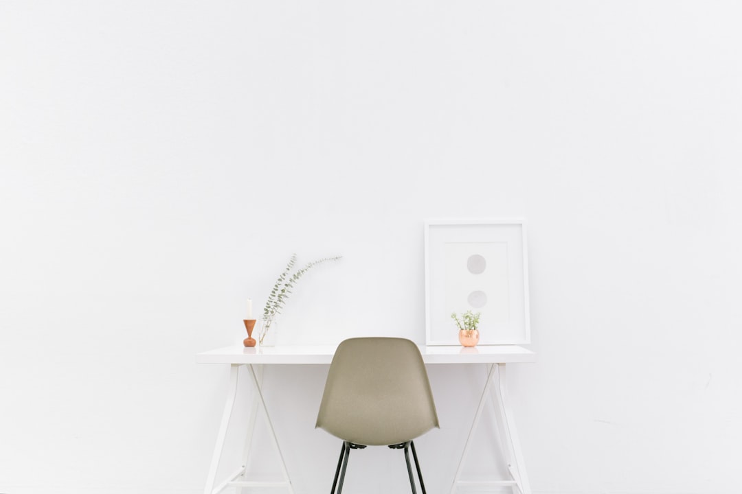A serene and organized living space with minimal furniture and decor, showcasing a clutter-free environment.