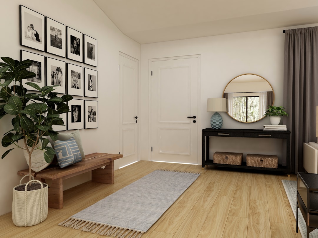 A beautifully arranged entryway featuring a stylish console table, decorative plants, and inviting lighting.